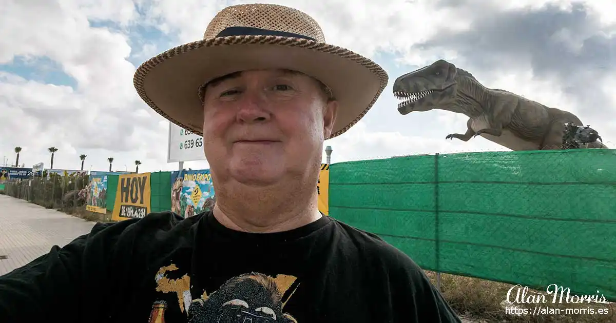 Alan Morris in front of a dinosaur next to the police station in Los Alcazares.